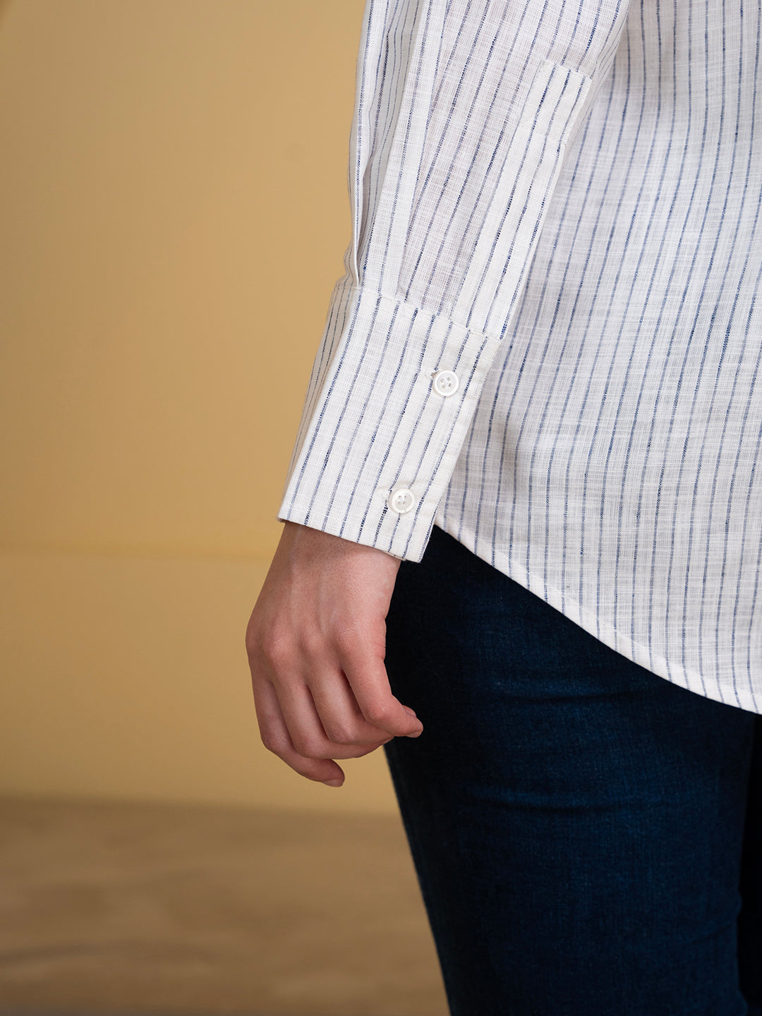 Full-length view of white and blue linen blend shirt