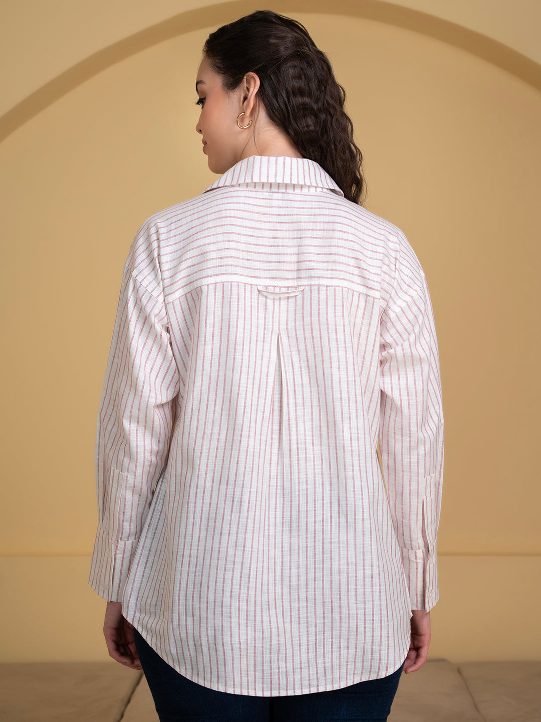 Styled view of white pink linen shirt with trousers