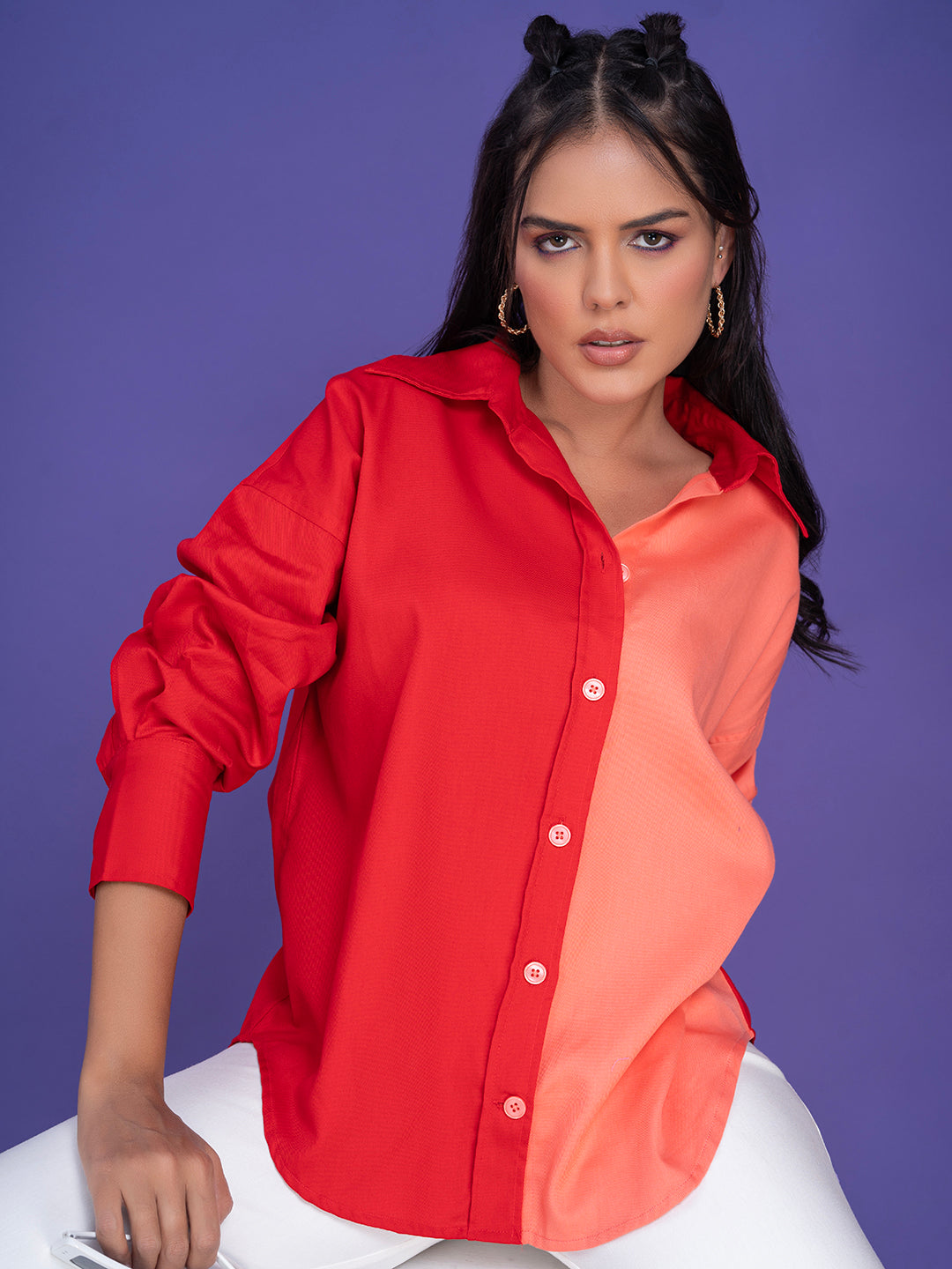 Curved hem and cuff detail of the oversized shirt