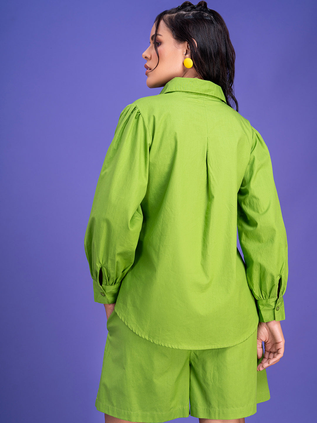 Detail of cotton shirt fabric in lime green co-ord
