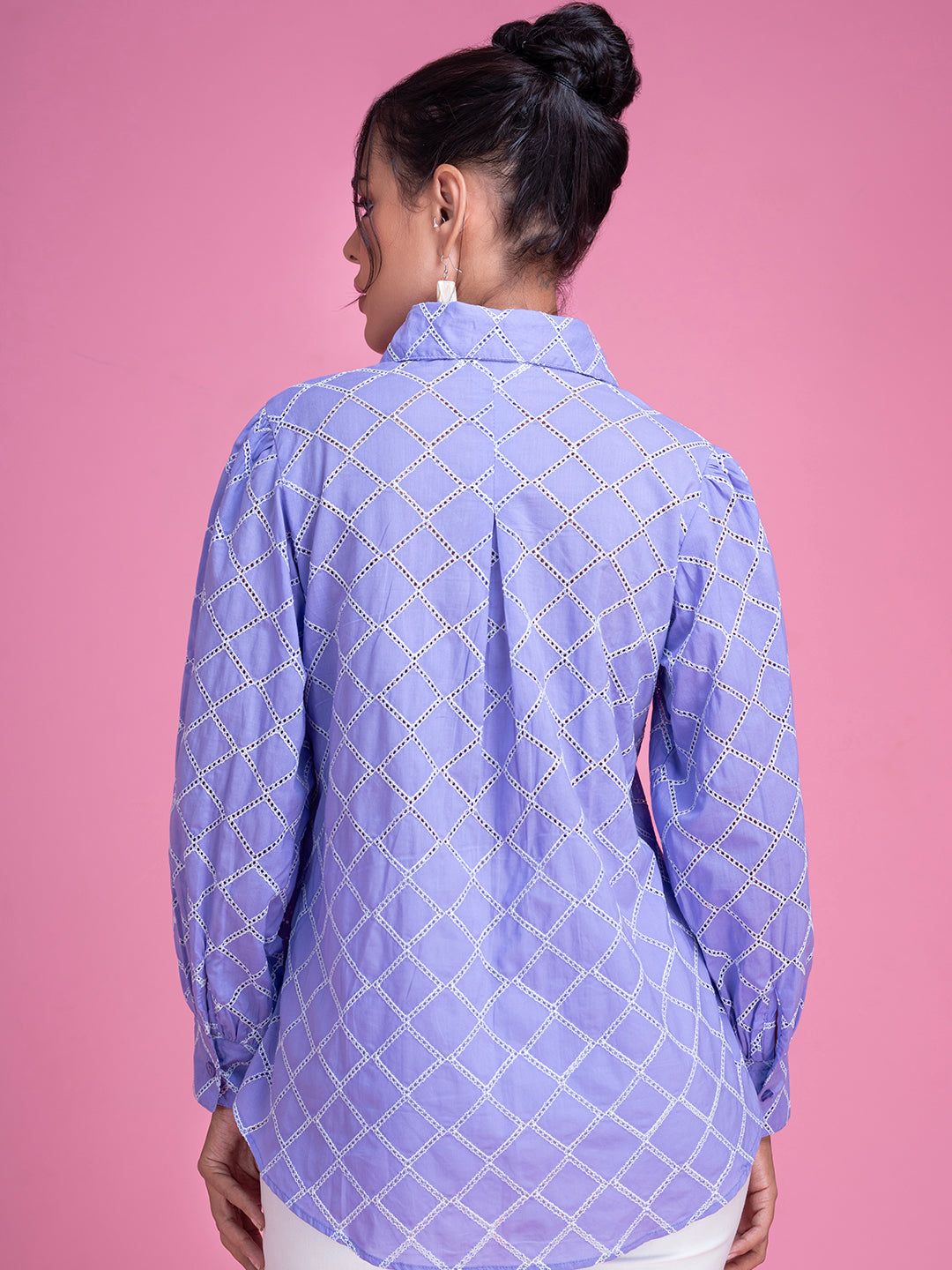 Close-up of schiffli embroidery on purple cotton shirt