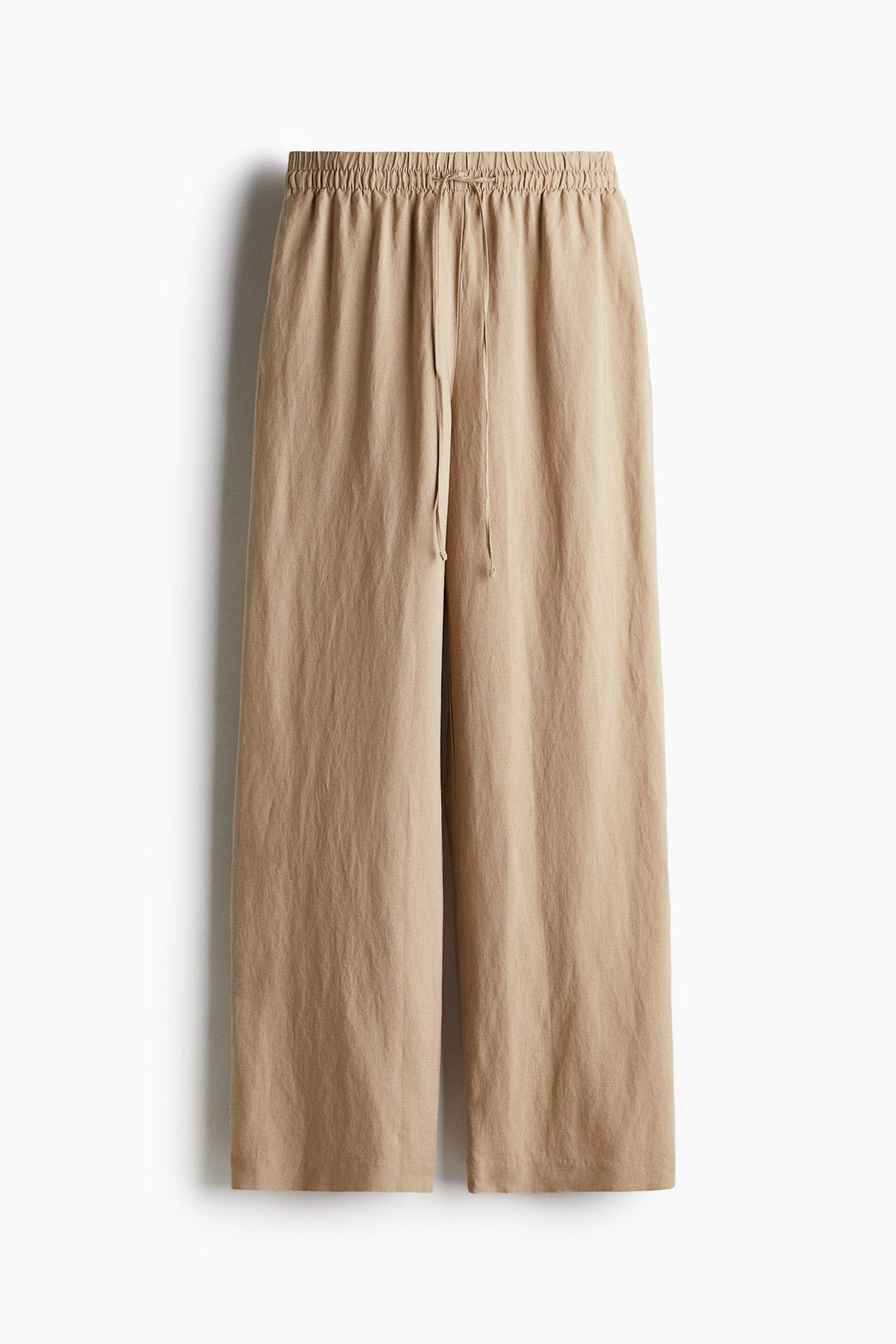 Front view of beige linen blend baggy trousers for women