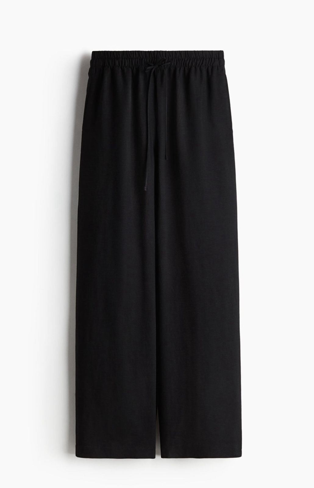 Front view of black linen blend baggy trousers for women