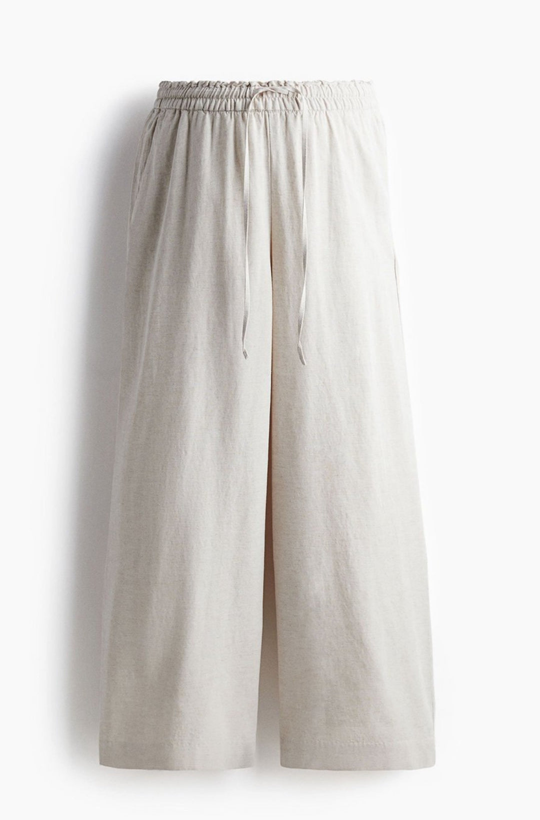 Front view of off-white linen blend baggy trousers for women