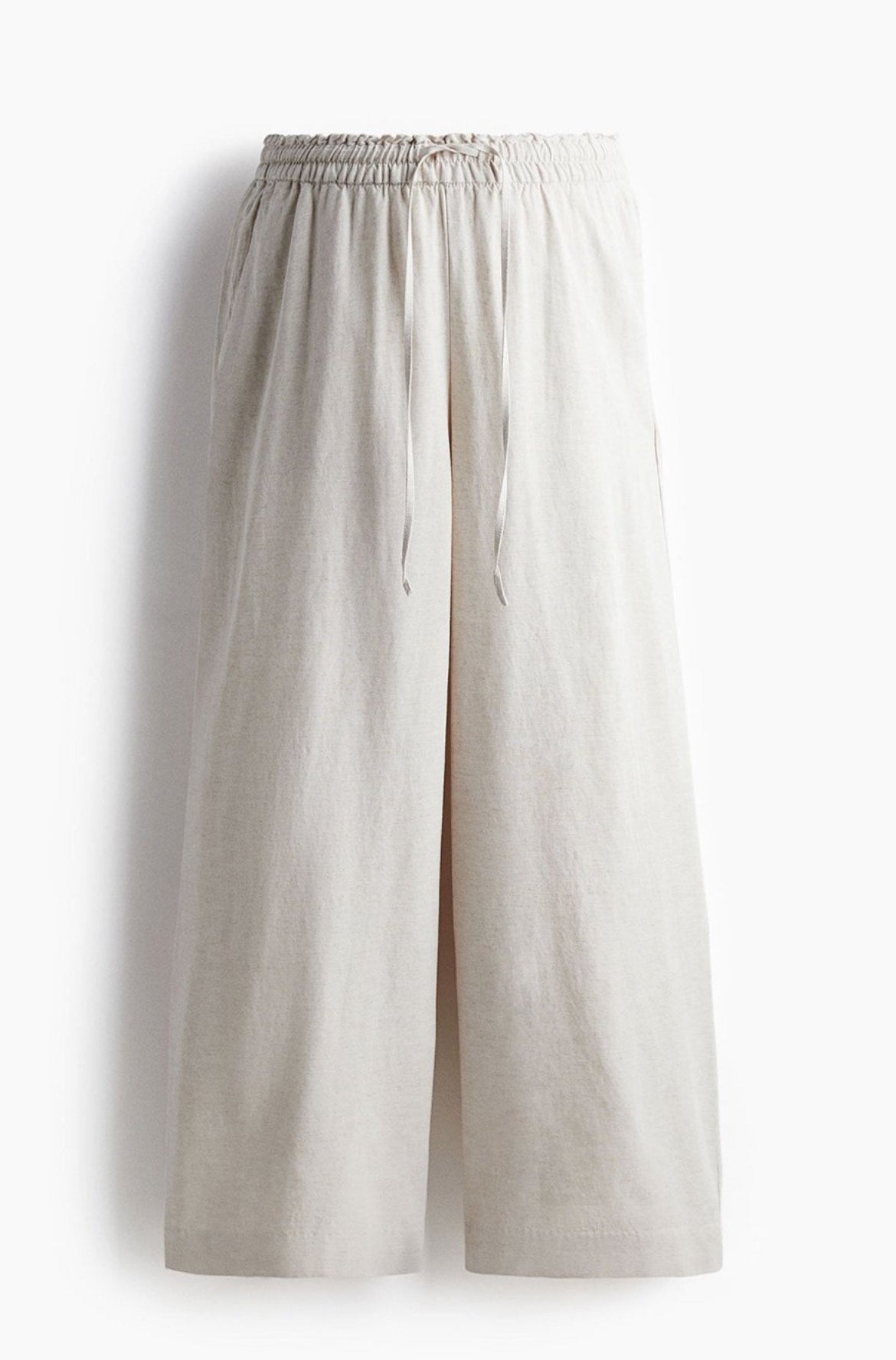 Front view of off-white linen blend baggy trousers for women