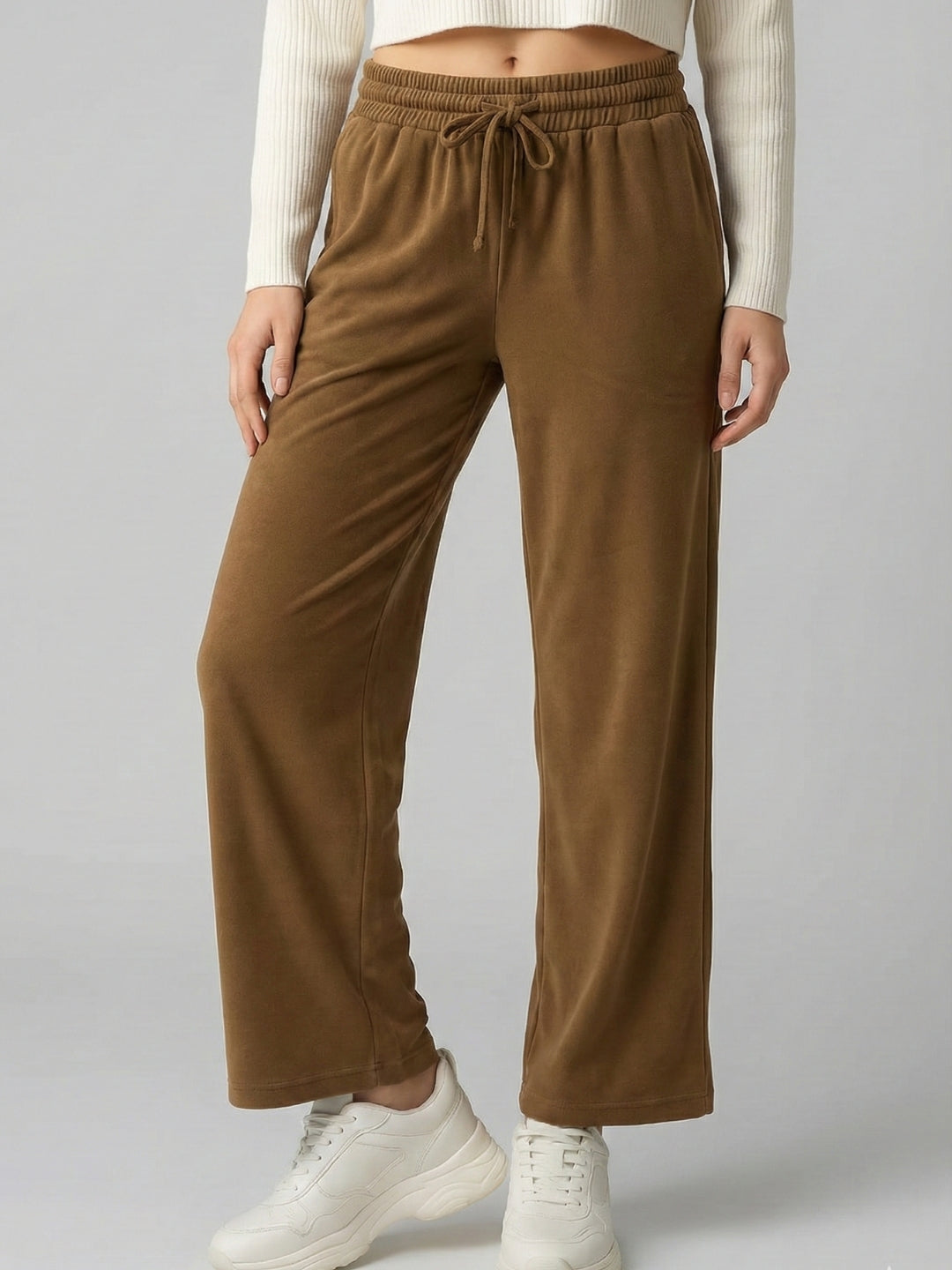 Front view of brown velvet drawstring trousers for women