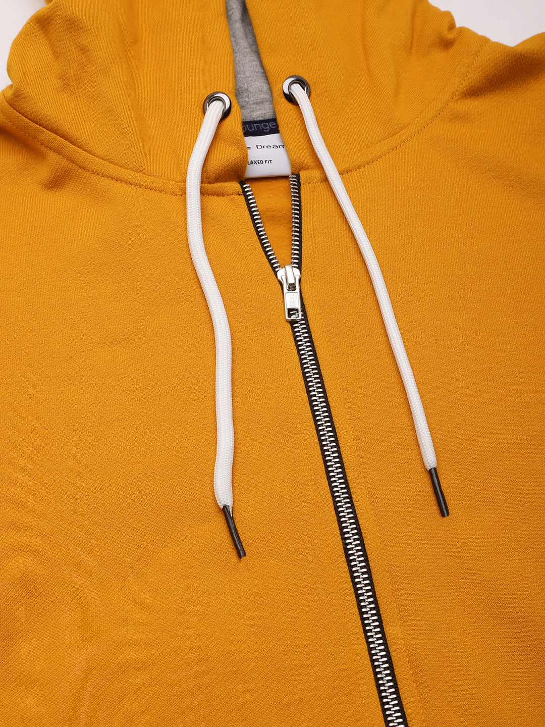 Detail shot of mustard fleece fabric