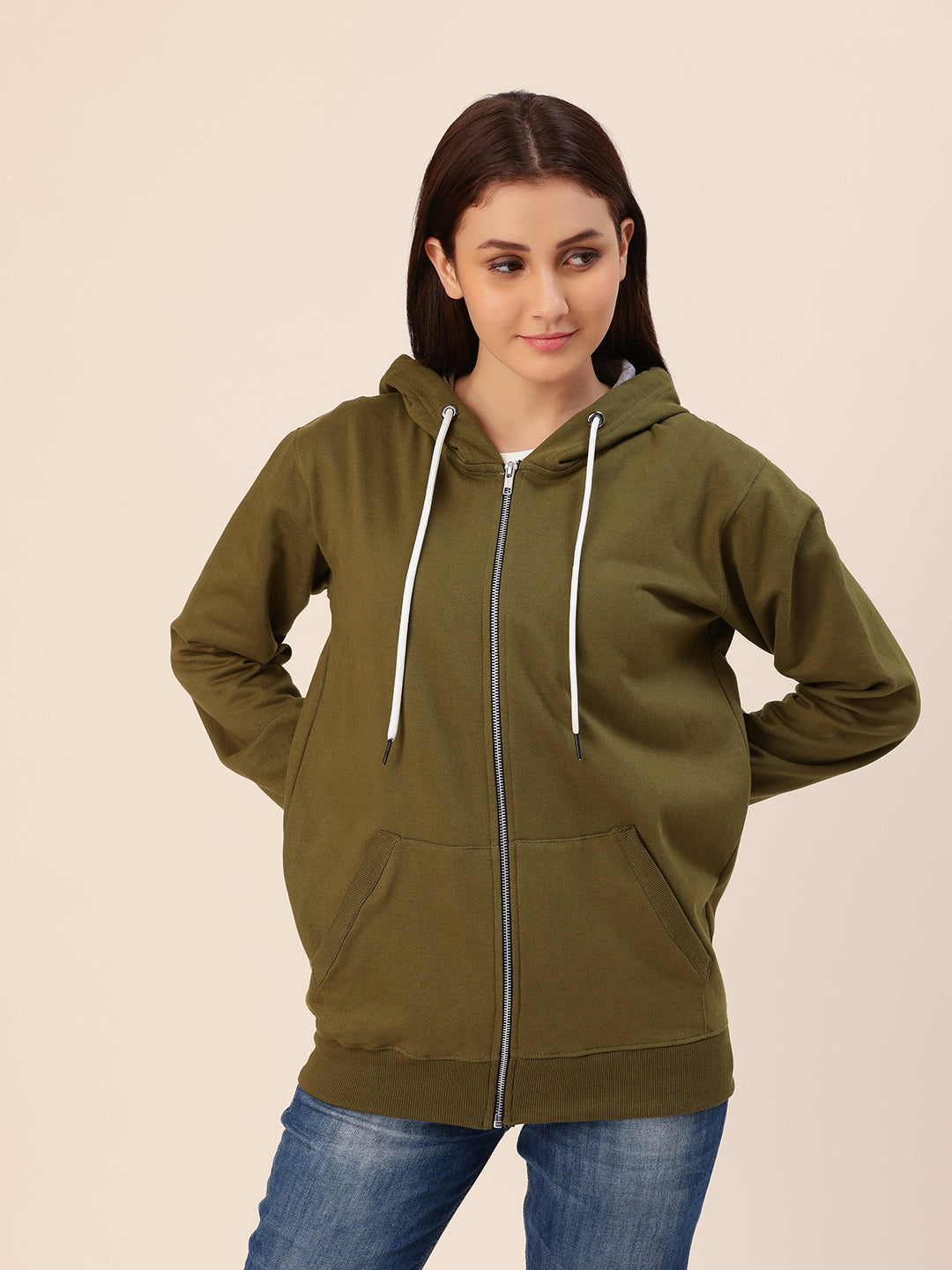 Close-up of hood and ribbed cuffs on olive hoodie