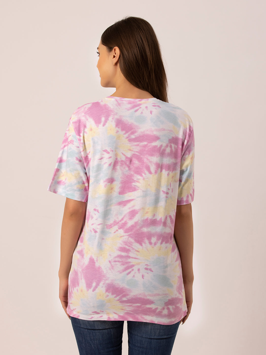 Full outfit shot styled with tie and dye oversized t-shirt