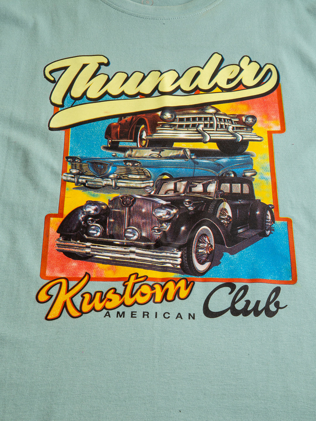 Lifestyle shot of woman in Thunder Kustum oversized tee