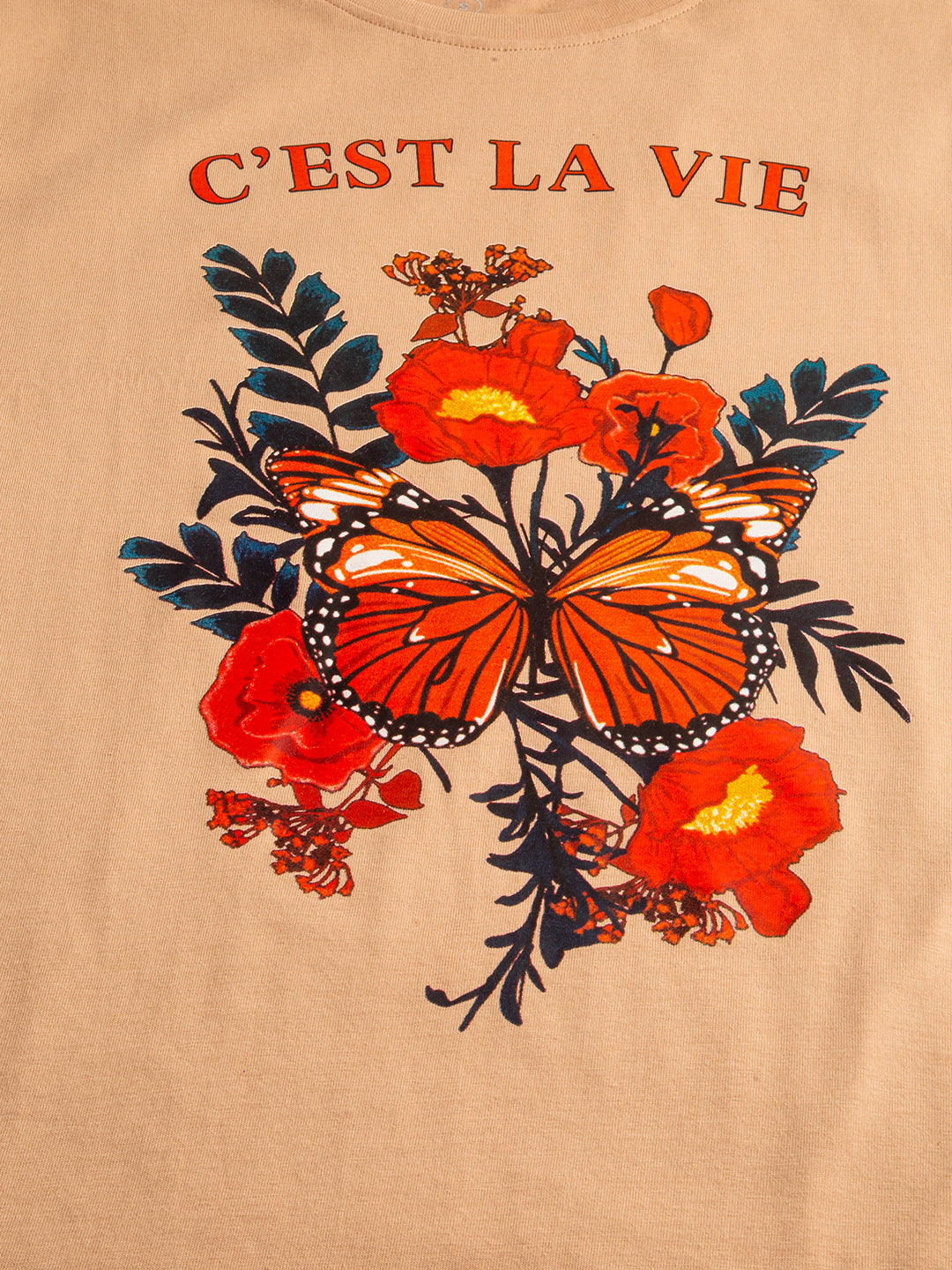 Close-up of C'est La Vie text graphic print on cotton tee