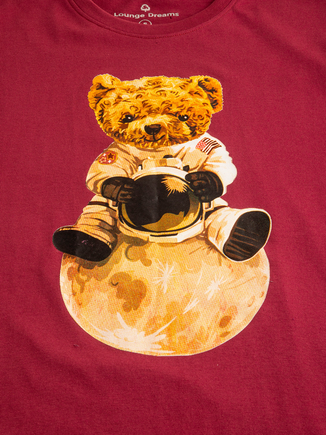 Lifestyle shot of woman in Astronaut Teddy oversized tee