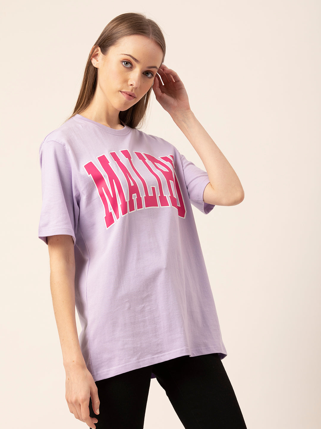 Lifestyle shot of woman in Malibu oversized tee