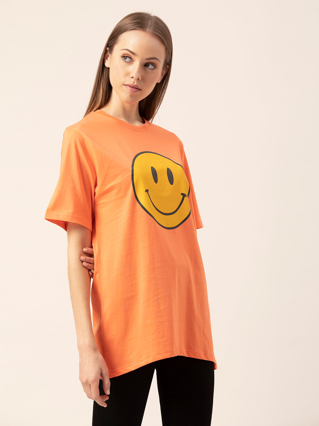Full outfit shot styled with Smiley oversized tee